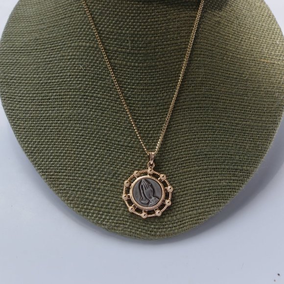 Jewelry - Rose gold tone and grey praying hands necklace. 15